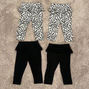 Four pairs of girls Garanimals leggings Size 12 months.